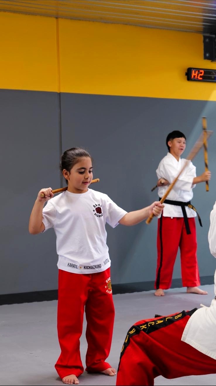 SAMA student practising coordination with training sticks